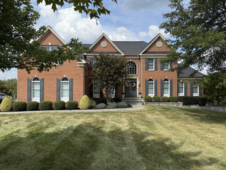 house with manicured landscaping by landscape services